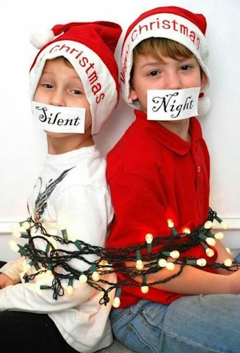 children tied up with christmas lights